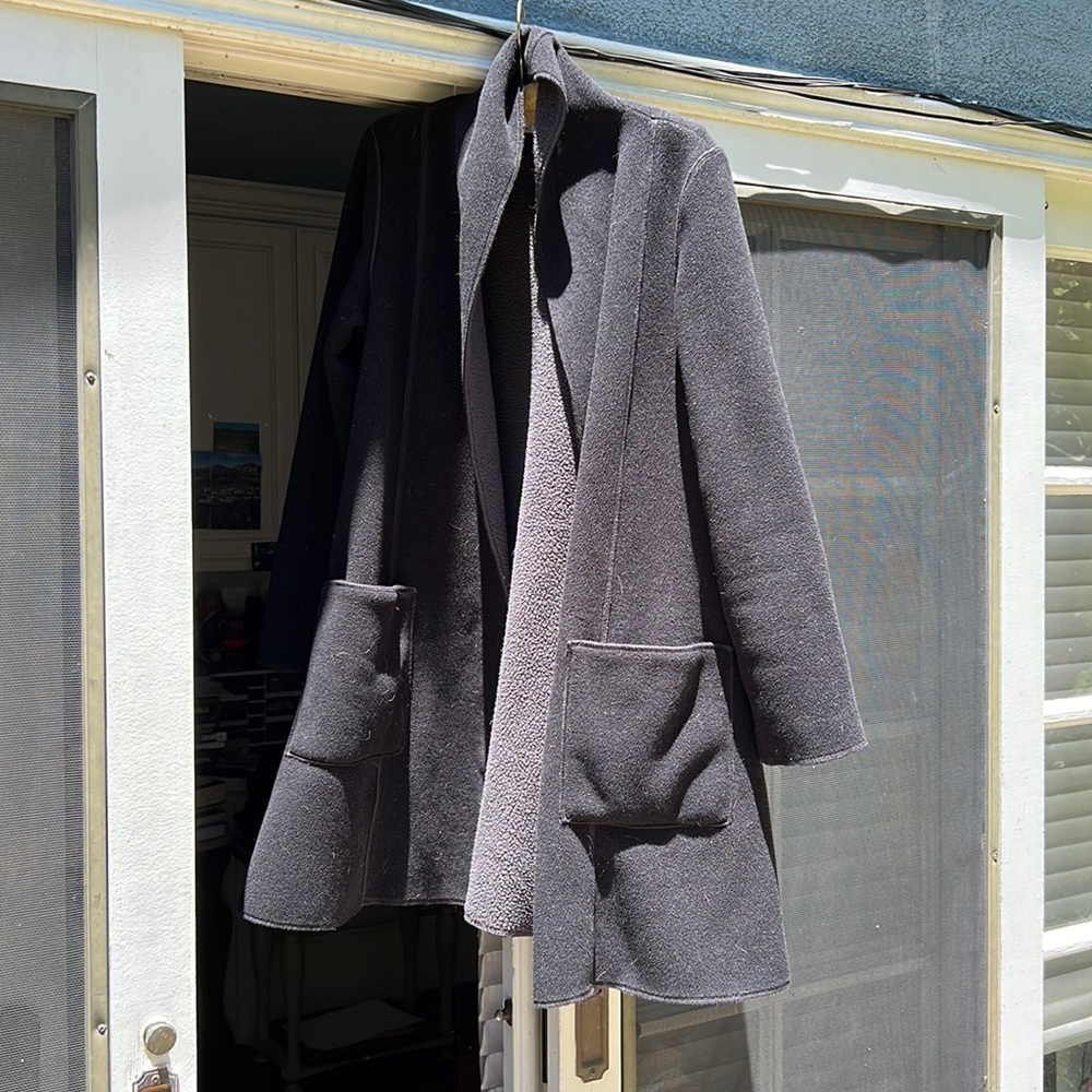 Jacket black grey lined big pockets no buttons shawl collar. Brand is chameleon